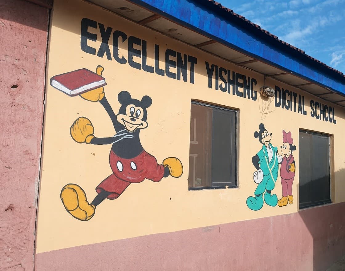 Excellent Yisheng Digital School building with painted mural and signage